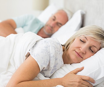 Older couple sleeping peacefully 