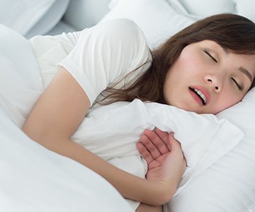 Young woman snoring 