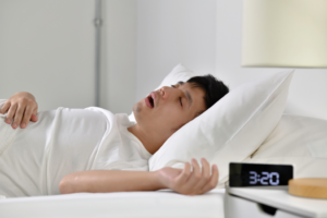 a man with sleep apnea snoring