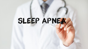 Doctor writing the words “sleep apnea” with a marker